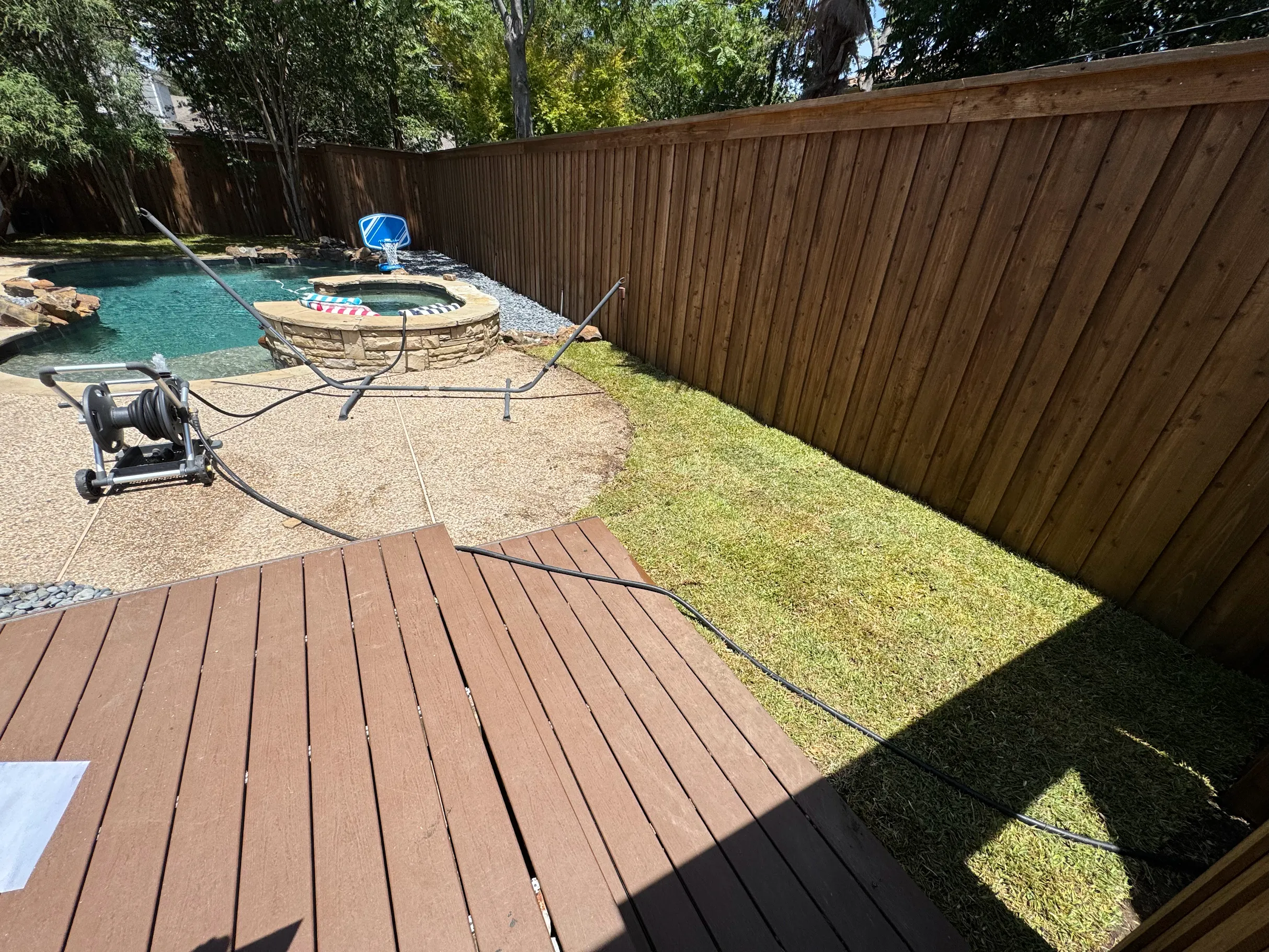 Rock pathway along pool fence