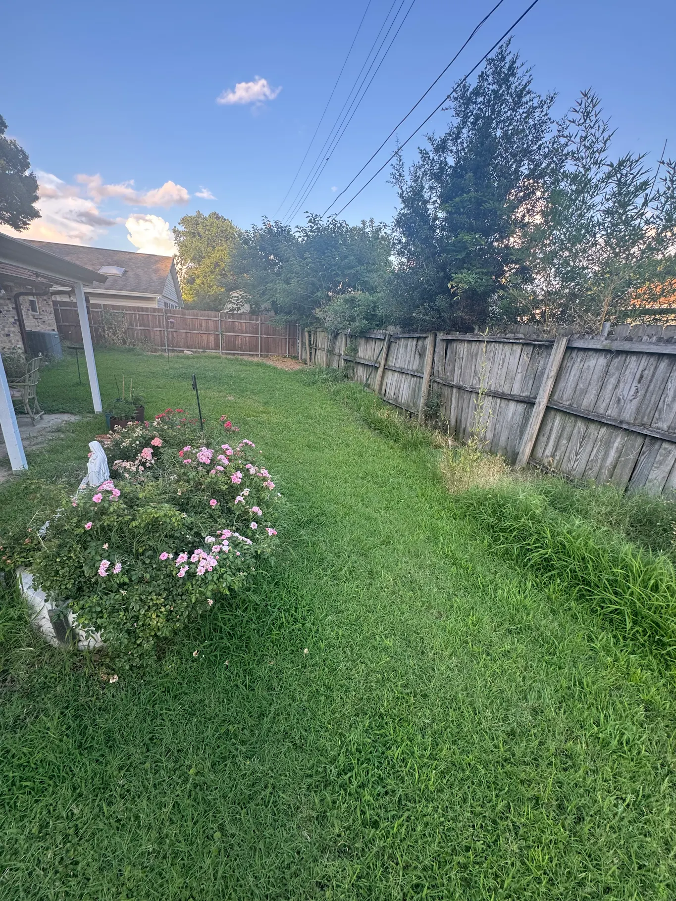 Maintained yard with flower beds
